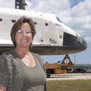 Lori Burke with Shuttle Atlantis